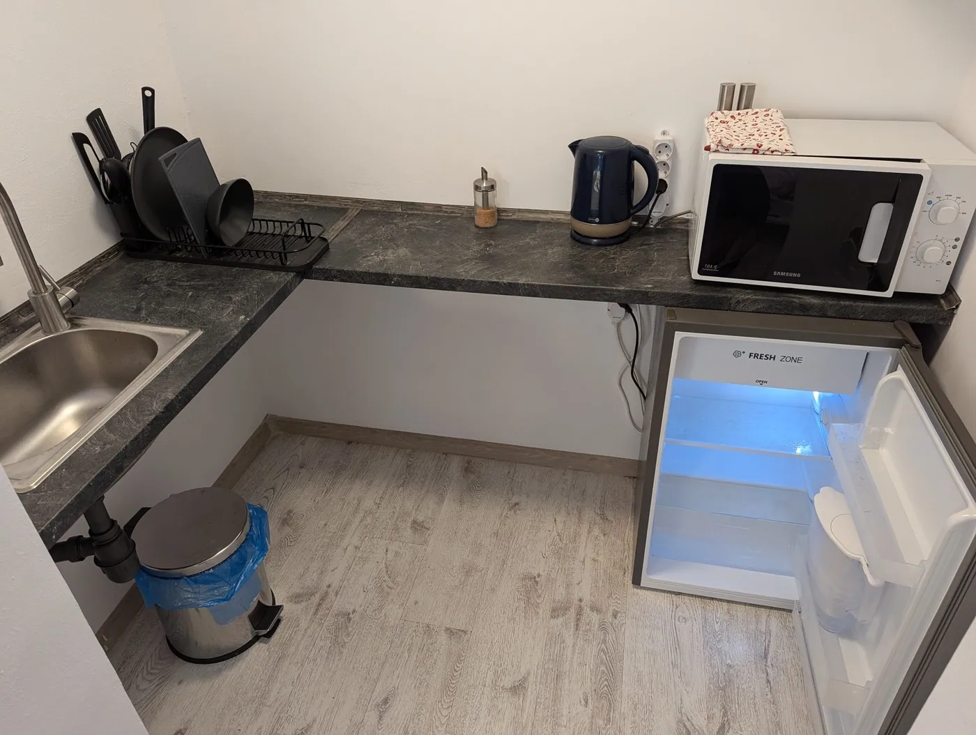 Serene Studio kitchenette with sink, fridge and microwave